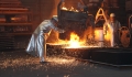 workers creating steel in a factory 