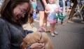 YP petting a puppy at the farmers market - Quad Cities