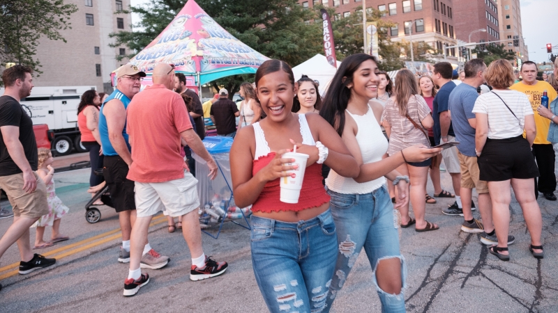 YPs enjoying a downtown festival - Quad Cities