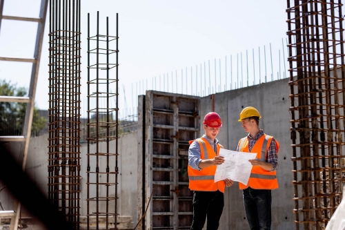 Engineers looking over construction plans