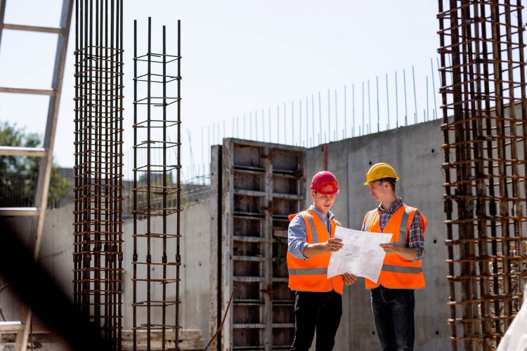 Engineers looking over construction plans